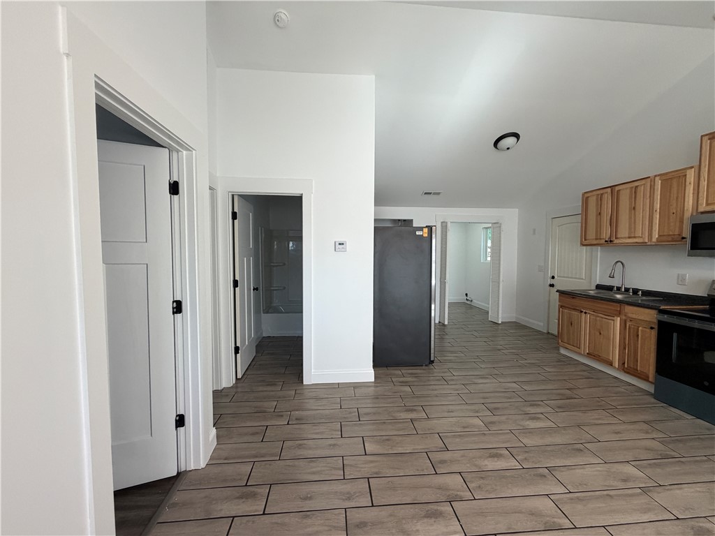 2910 Chambers Road Anderson, SC 29626 - Photo 2 of 16 Gleaming tile flooring and soaring ceilings define this modern open-concept space.