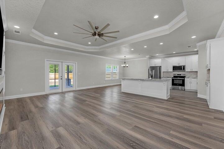 707 Northwest Lovejoy Road Fort Walton Beach, FL 32548 - Photo 3 of 4 a view of kitchen with furniture and wooden floor