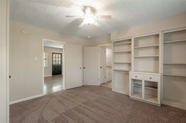 a view of a kitchen with a sink and cabinet
