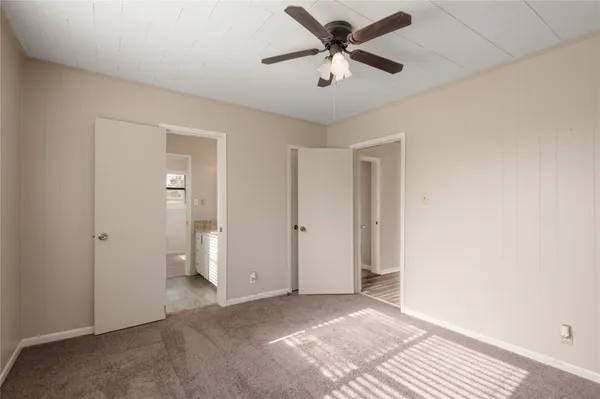 a view of a big room with wooden floor and closet in a room