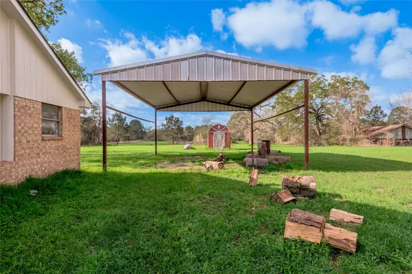 a view of a couches in backyard of house