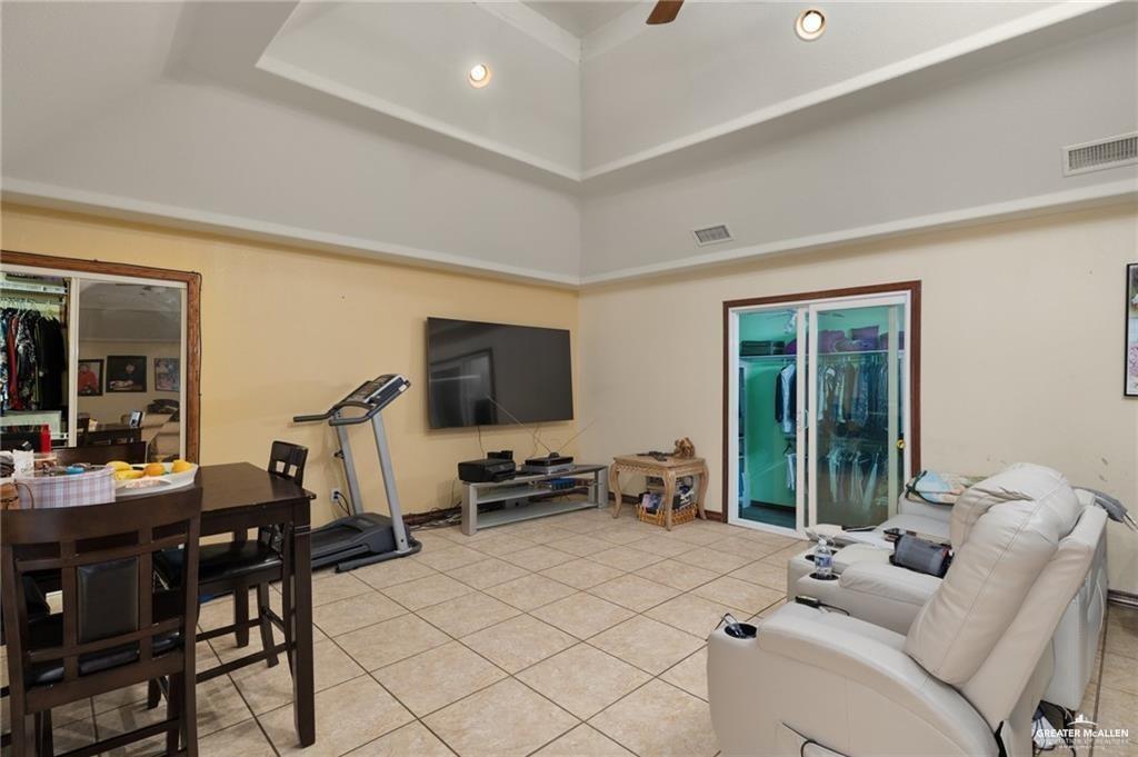 4523 South Tower Road Edinburg, TX 78542 - Photo 20 of 32 a living room with furniture and a flat screen tv