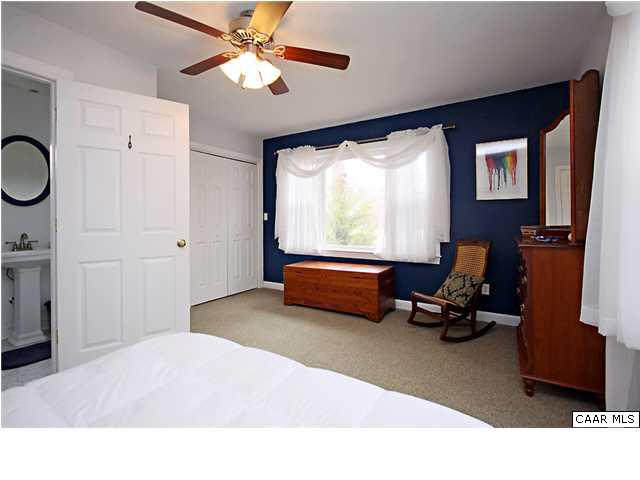 254 Dry Bridge Road Charlottesville, VA 22903 - Photo 13 of 26 a bedroom with furniture and a large window