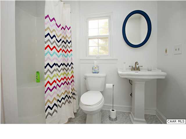 254 Dry Bridge Road Charlottesville, VA 22903 - Photo 15 of 26 a bathroom with a sink toilet and a mirror