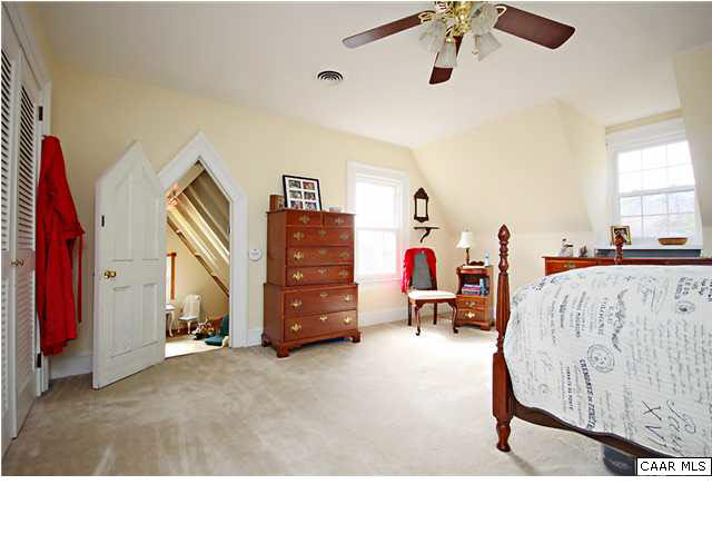 254 Dry Bridge Road Charlottesville, VA 22903 - Photo 18 of 26 a living room with furniture and a chandelier