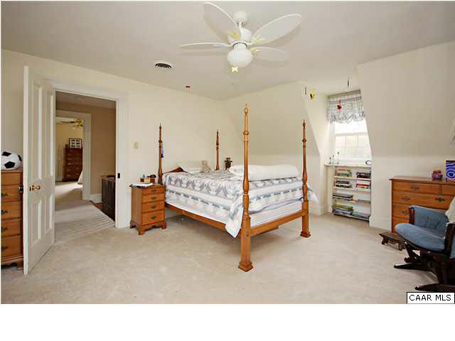 254 Dry Bridge Road Charlottesville, VA 22903 - Photo 21 of 26 a living room with furniture and a chandelier