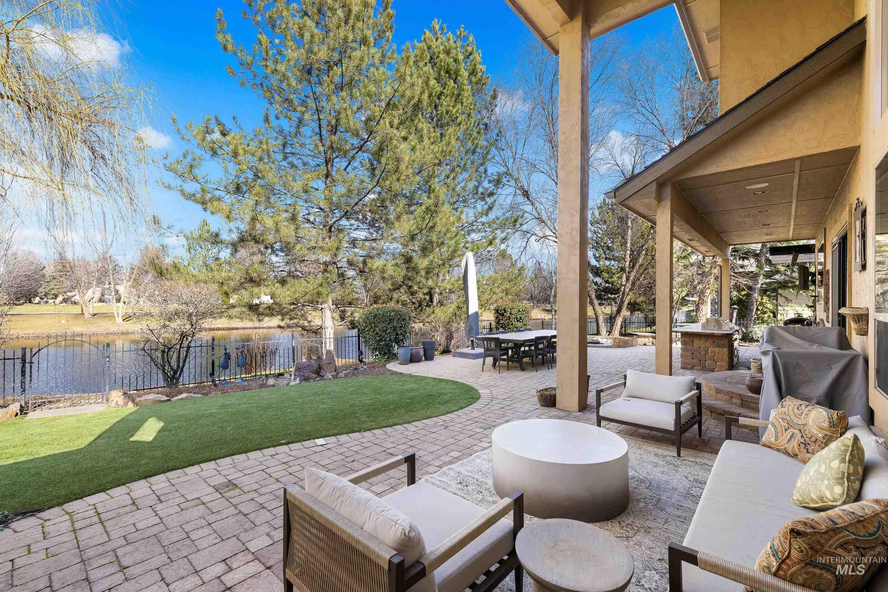 1166 East Rivers End Drive Eagle, ID 83616 - Photo 42 of 50 View of patio featuring an outdoor living / dining area and a water view