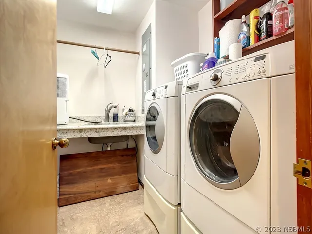 a utility room with dryer and washer