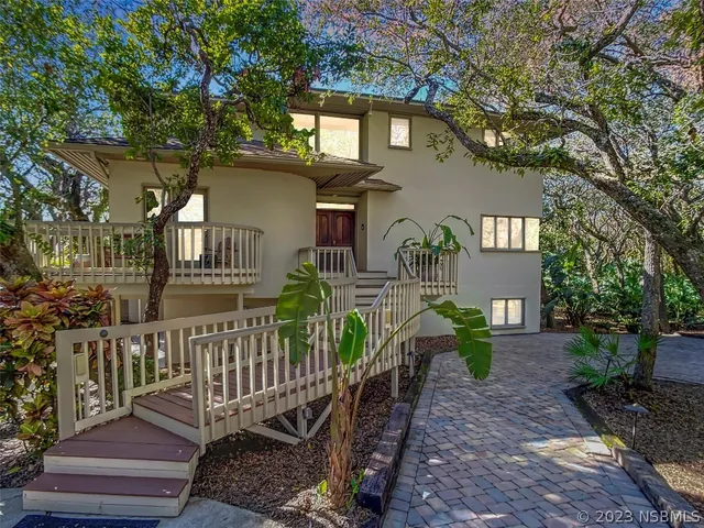 a front view of house yard and deck