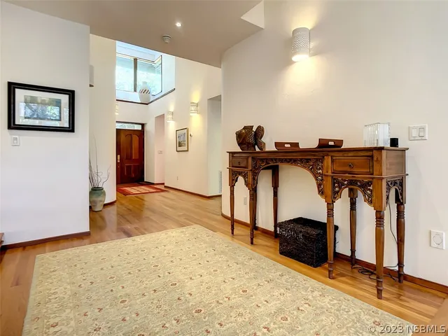 a view of a livingroom with furniture and a flat screen tv