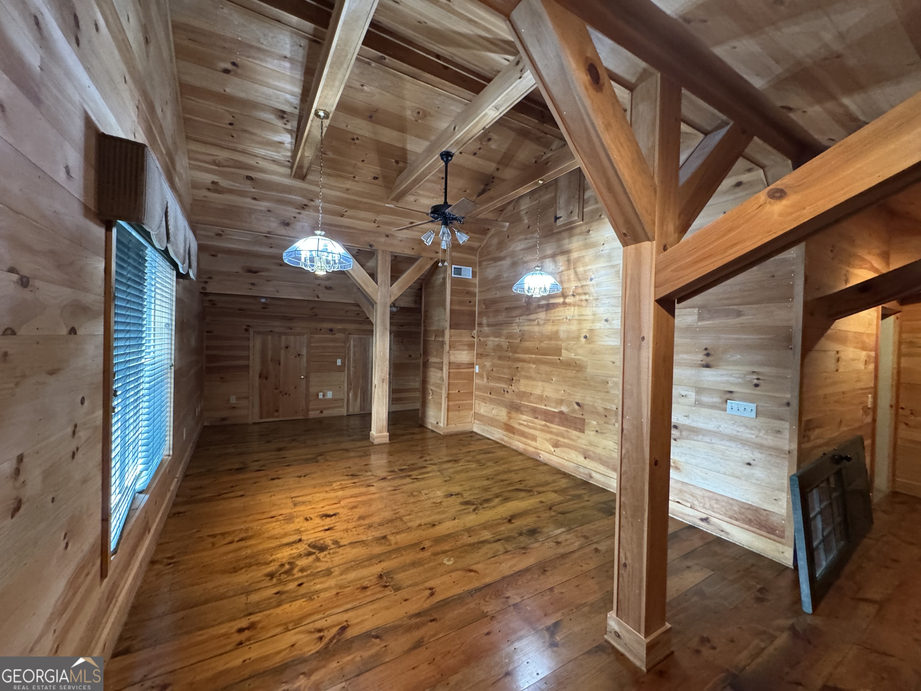1045 Pleasant Hill Road Jasper, GA 30143 - Photo 11 of 20 a view of a room with wooden floor