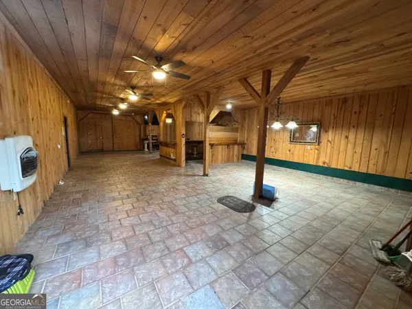 a view of a hall with wooden floor