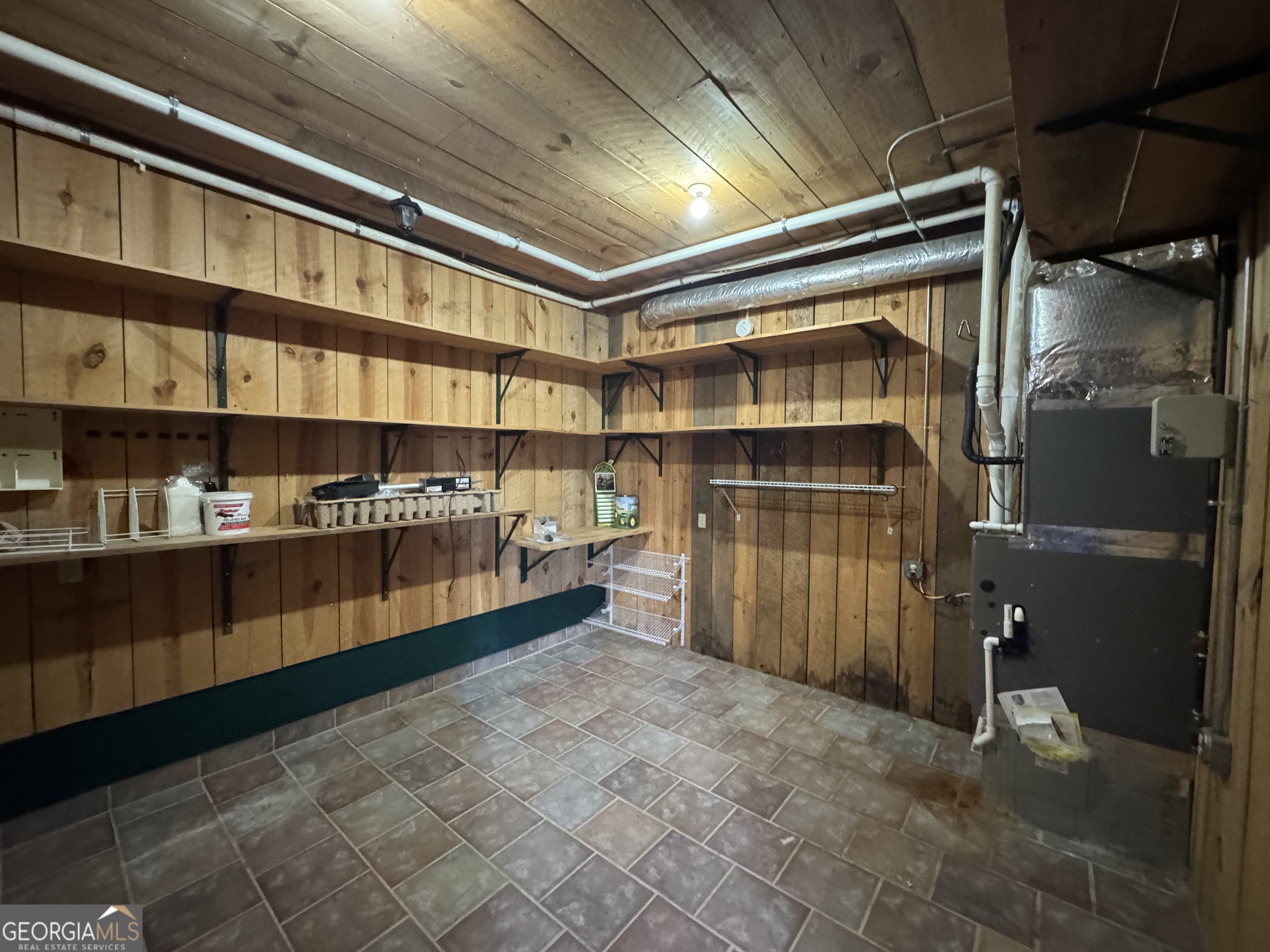 1045 Pleasant Hill Road Jasper, GA 30143 - Photo 20 of 20 a storage room with washer and dryer
