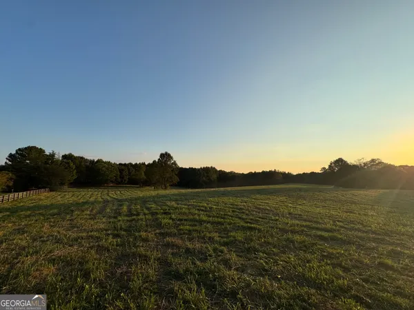 a view of an ocean beach and mountain