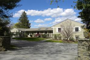 46 Pine Brook Road Bedford, NY 10506 - Photo 1 of 1 a front view of house with yard and green space