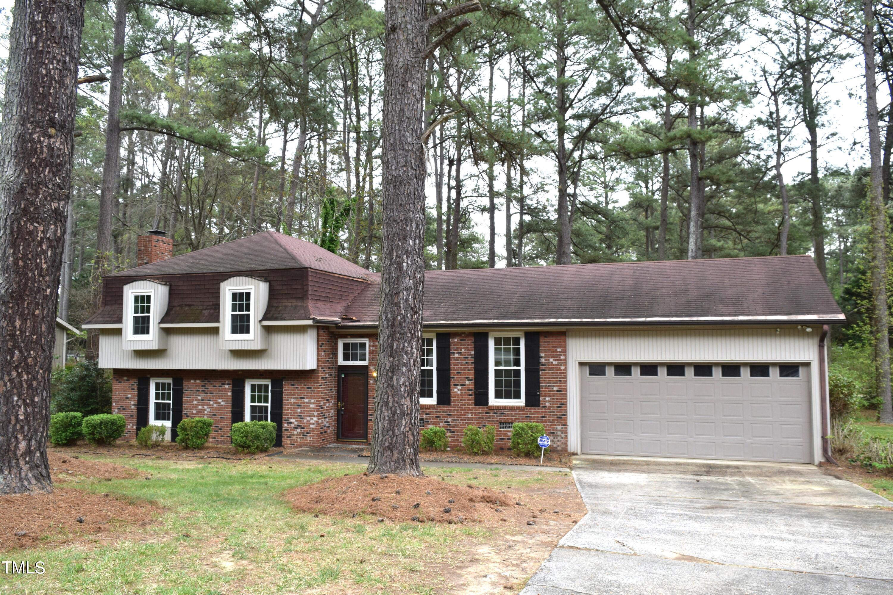 2731 Umstead Road Durham, NC 27712 - Photo 3 of 22 a front view of a house with a yard