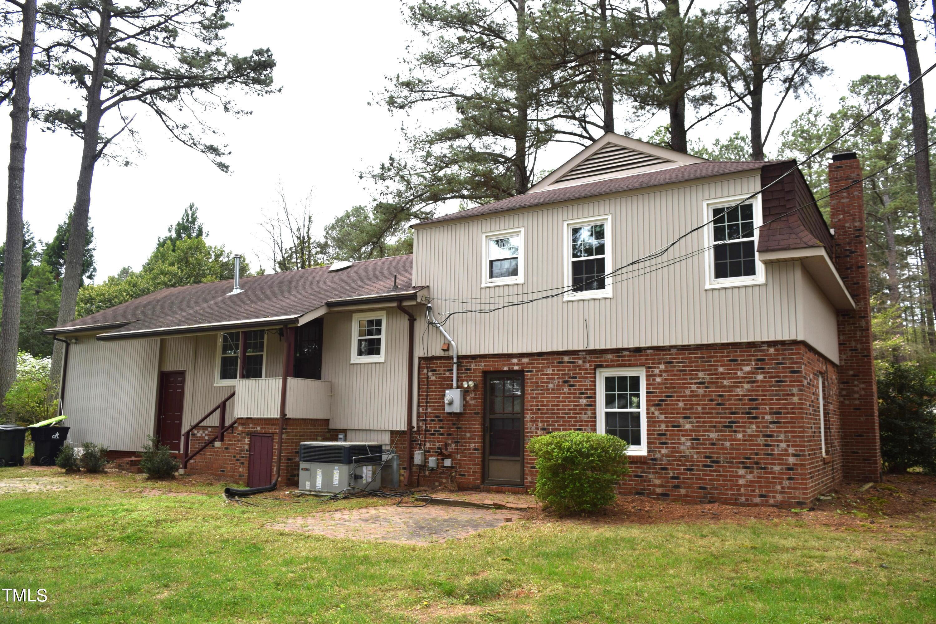2731 Umstead Road Durham, NC 27712 - Photo 4 of 22 a view of a house with a yard and sitting area