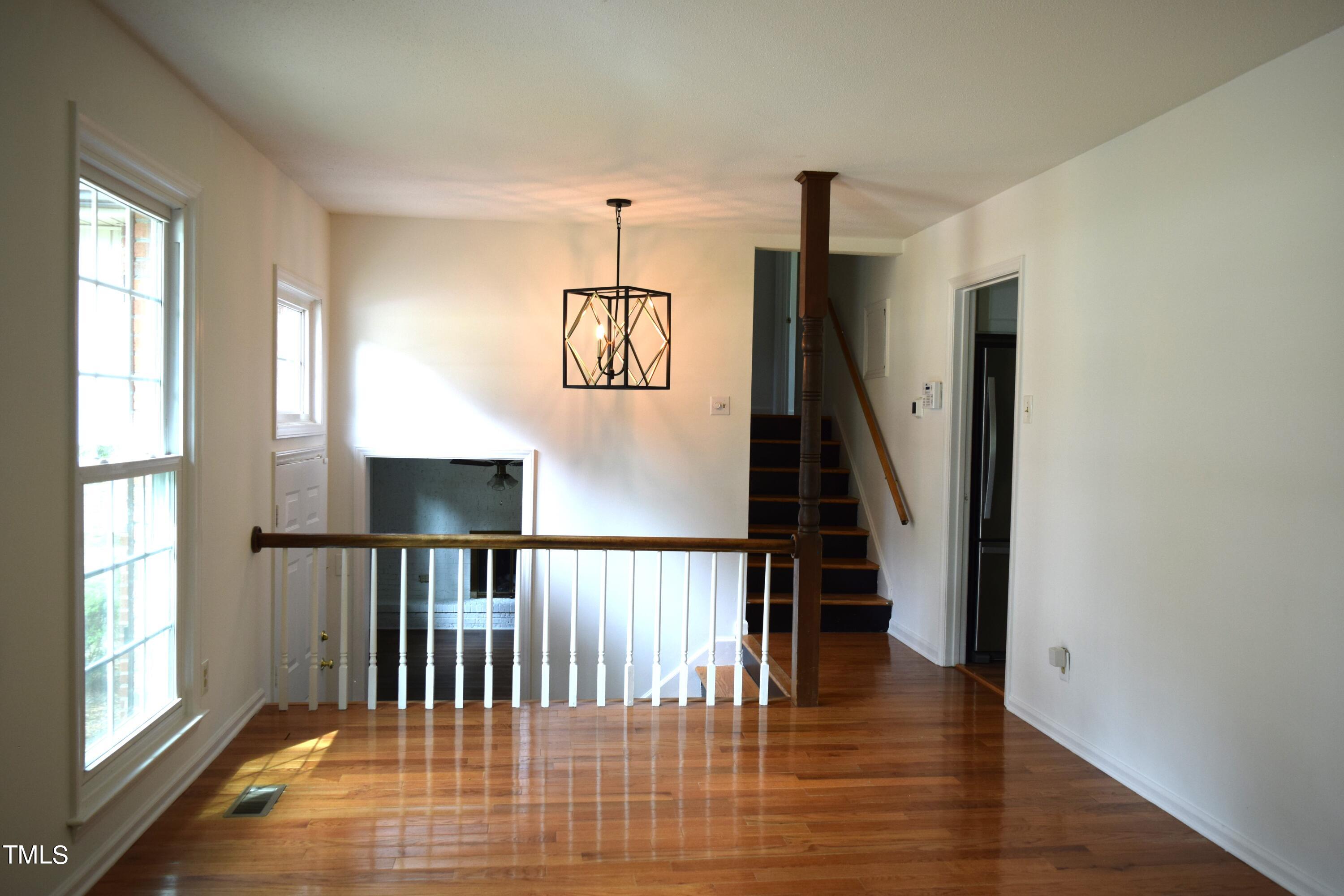 2731 Umstead Road Durham, NC 27712 - Photo 9 of 22 a view of entryway and hall with wooden floor