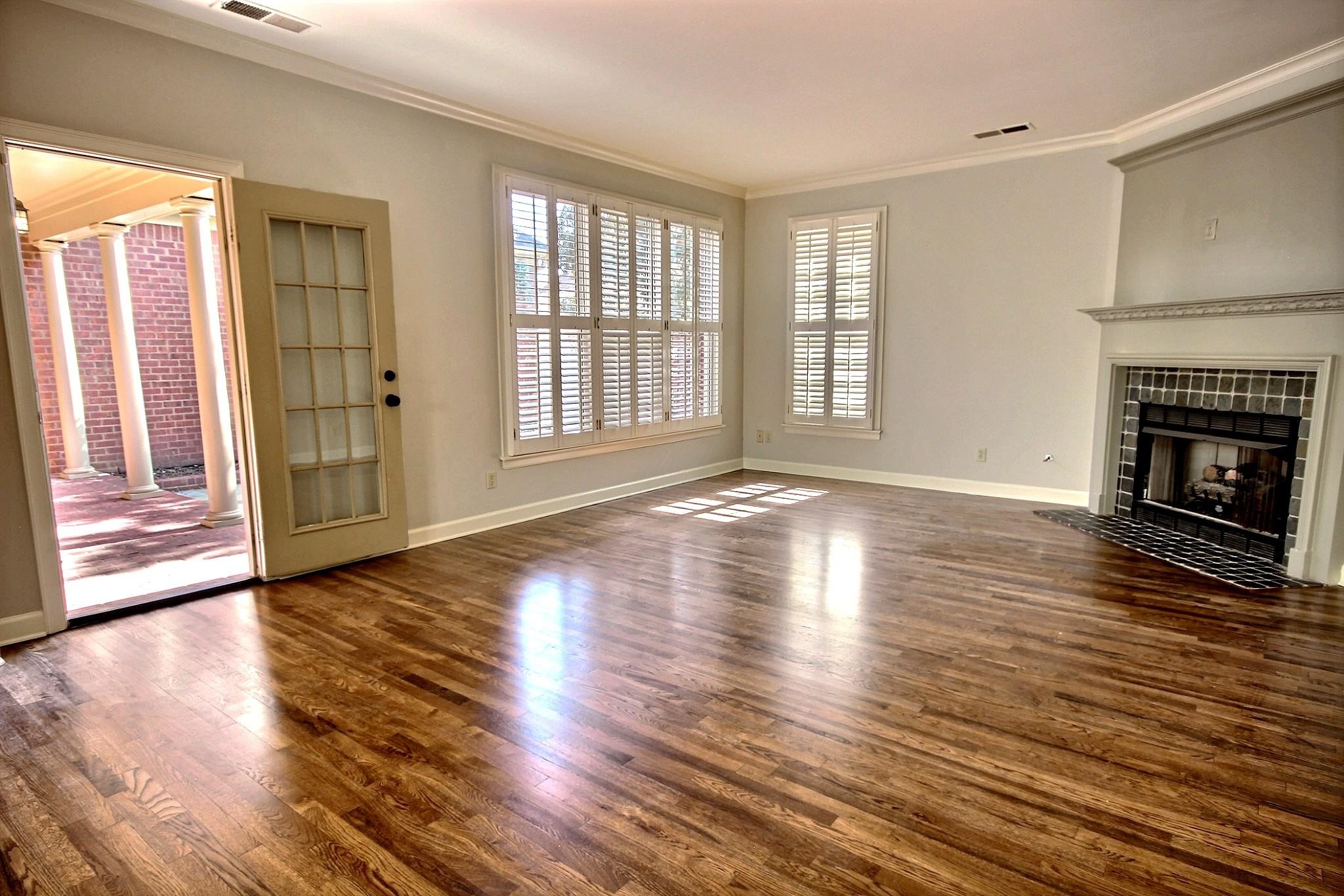 302 Colbert Street East Collierville, TN 38017 - Photo 15 of 33 Great room with fireplace and door leading to back patio with pool