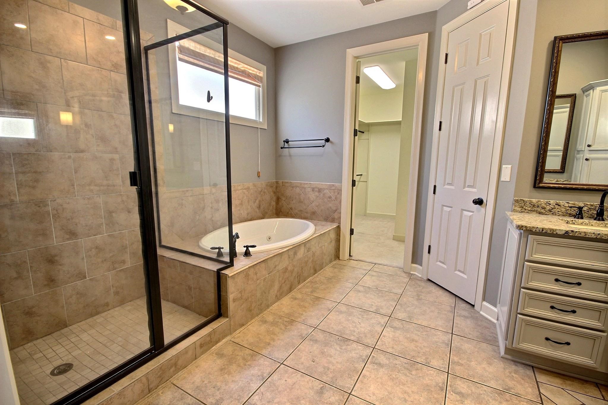 302 Colbert Street East Collierville, TN 38017 - Photo 20 of 33 Primary bathroom with separate jacuzzi tub and shower