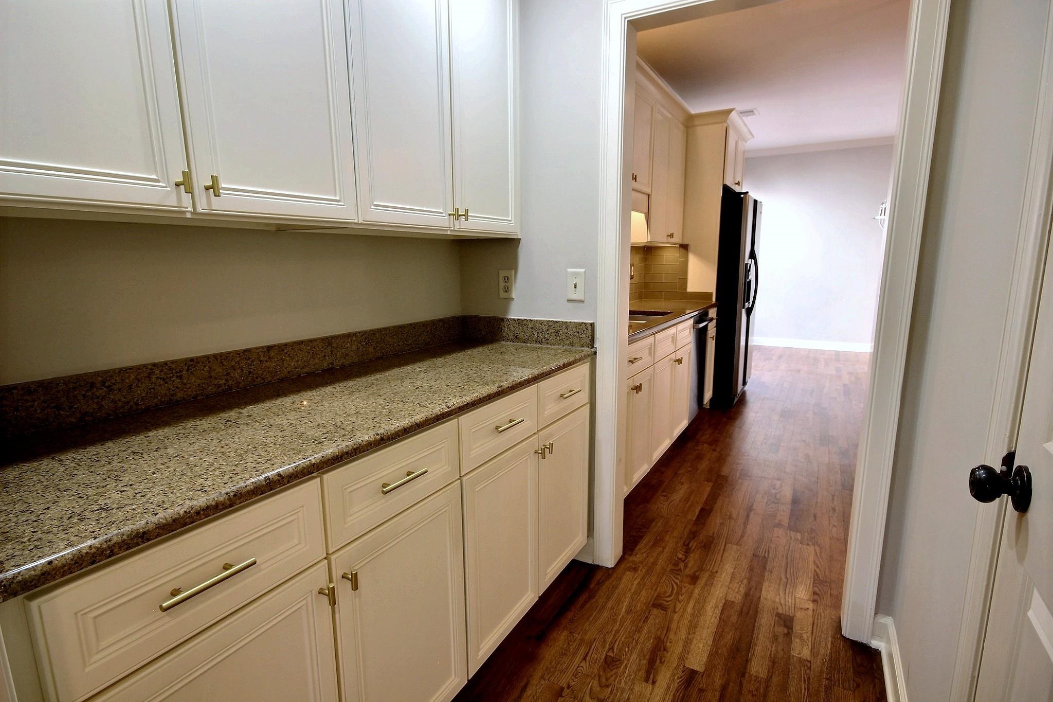 302 Colbert Street East Collierville, TN 38017 - Photo 9 of 33 Butlers pantry with granite countertops