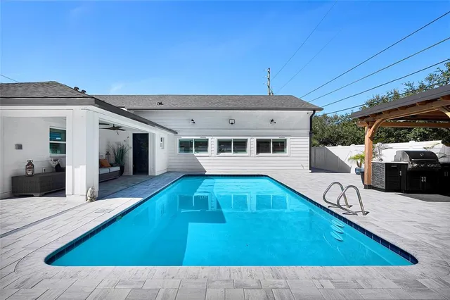 a view of a house with swimming pool