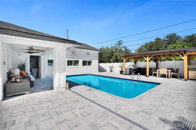 a large kitchen with a table and chairs
