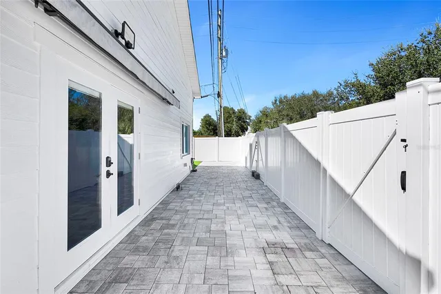 a large kitchen with stainless steel appliances a stove and a refrigerator
