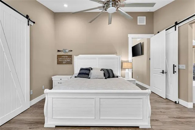 an aerial view of a house with a yard and garden