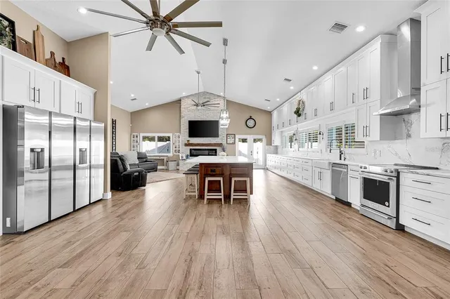 an aerial view of residential building and lake