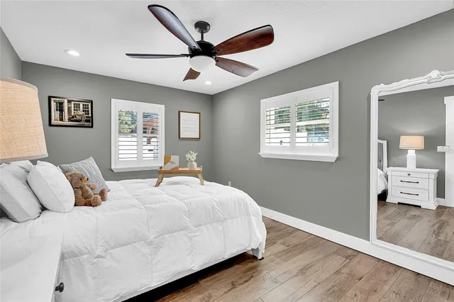 a bedroom with a large bed and a window