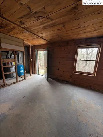 a view of a room with wooden walls
