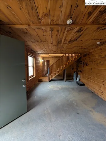 a view of an empty room with a garage