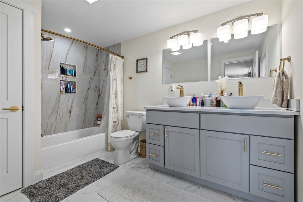 10 Walker Road Topsfield, MA 01983 - Photo 17 of 41 a bathroom with a sink a toilet and shower