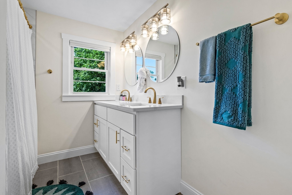 10 Walker Road Topsfield, MA 01983 - Photo 20 of 41 a bathroom with a sink and a mirror