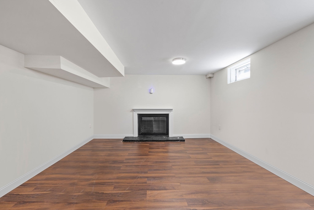 10 Walker Road Topsfield, MA 01983 - Photo 30 of 41 a view of an empty room with wooden floor and a window