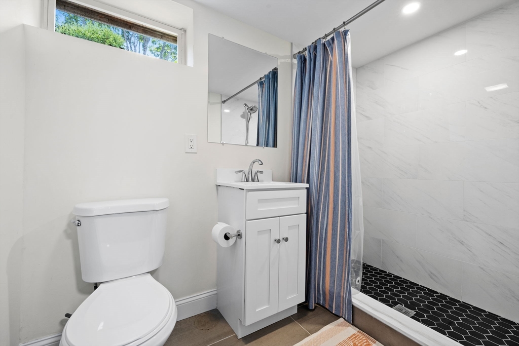 10 Walker Road Topsfield, MA 01983 - Photo 31 of 41 a bathroom with a sink toilet and shower