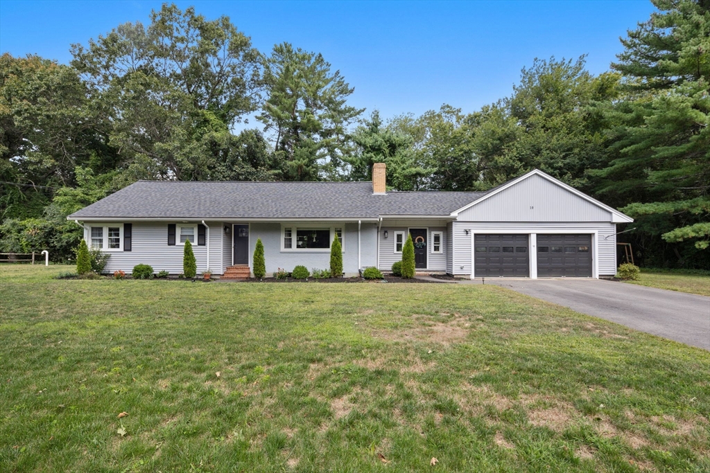 10 Walker Road Topsfield, MA 01983 - Photo 33 of 41 a front view of a house with a garden