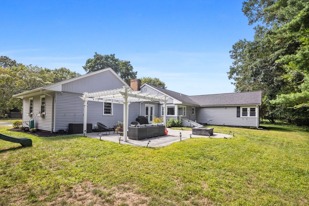10 Walker Road Topsfield, MA 01983 - Photo 35 of 41 a front view of a house with a garden and trees