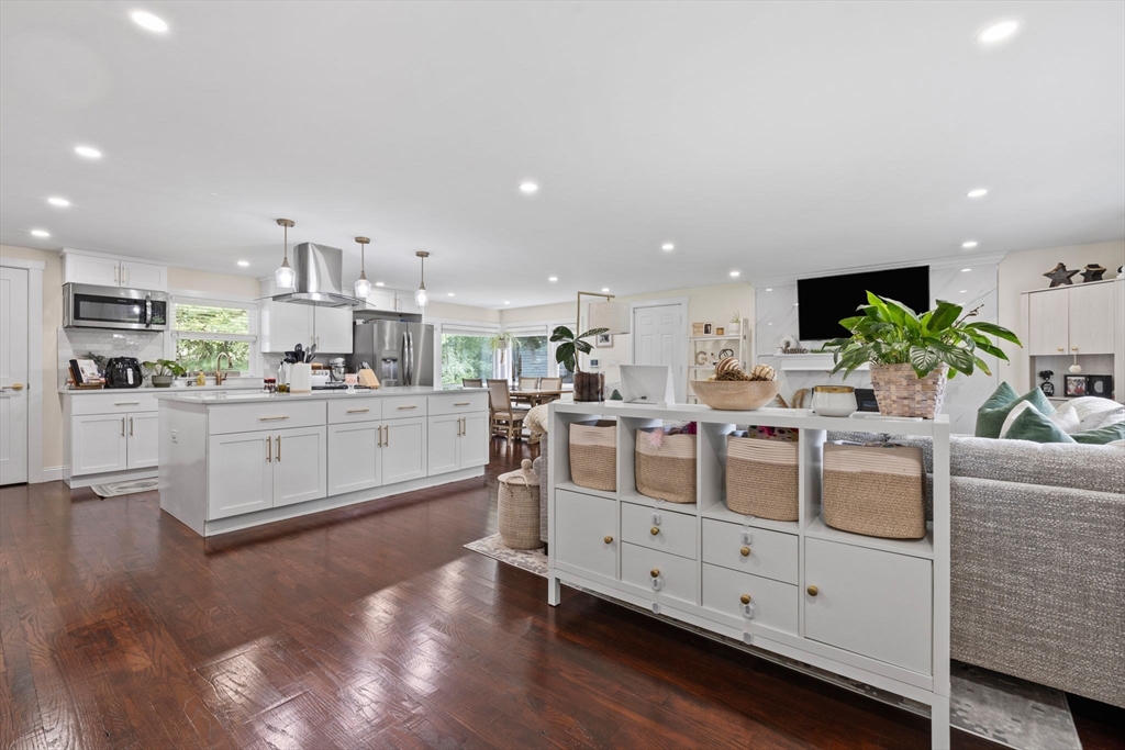 10 Walker Road Topsfield, MA 01983 - Photo 4 of 41 a kitchen with stainless steel appliances kitchen island granite countertop a stove a sink and a refrigerator