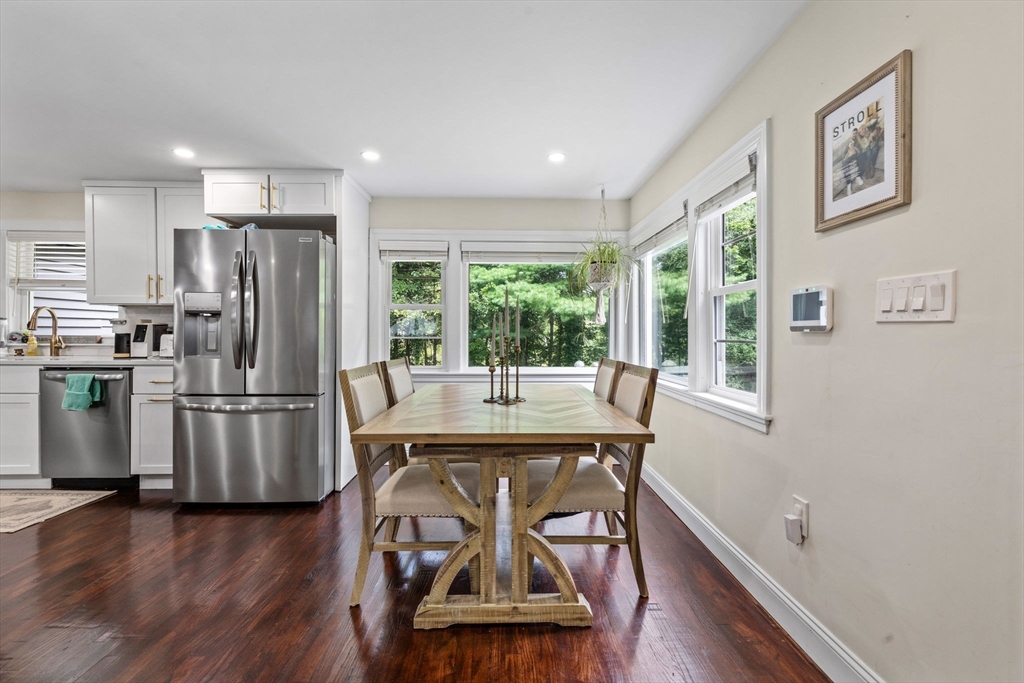 10 Walker Road Topsfield, MA 01983 - Photo 6 of 41 a kitchen with stainless steel appliances wooden floor and dining table