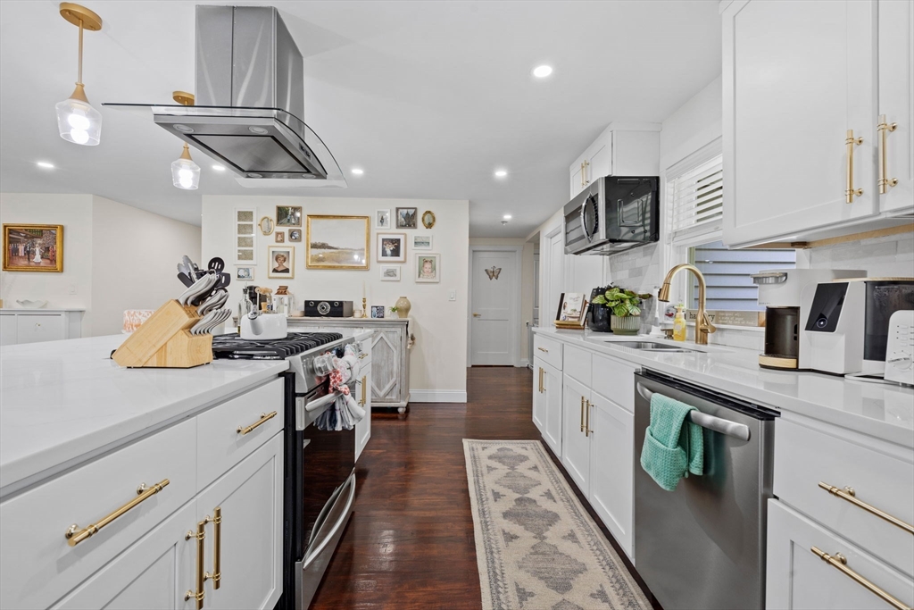 10 Walker Road Topsfield, MA 01983 - Photo 8 of 41 a kitchen with stainless steel appliances granite countertop lots of counter top space a sink and cabinets
