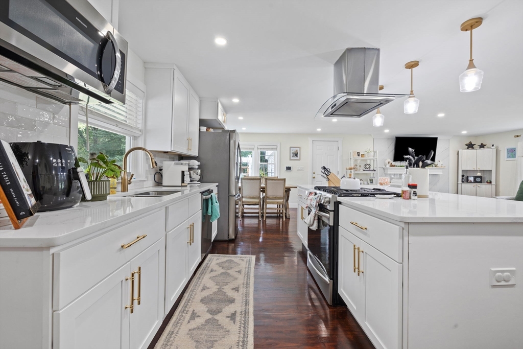 10 Walker Road Topsfield, MA 01983 - Photo 9 of 41 a kitchen with cabinets and stainless steel appliances