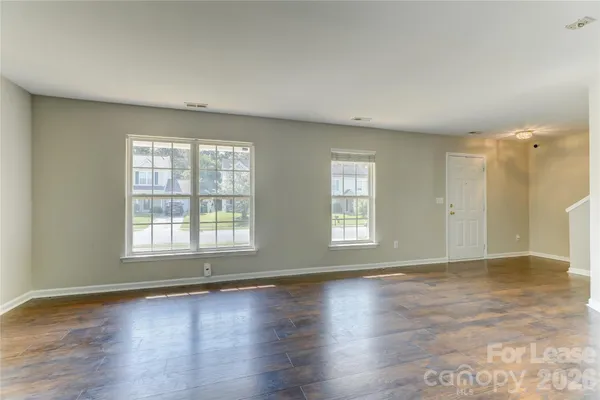 a view of an empty room and fire place