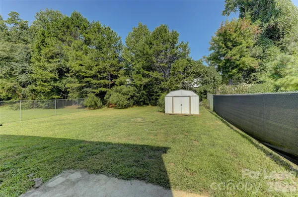 a view of a backyard of the house