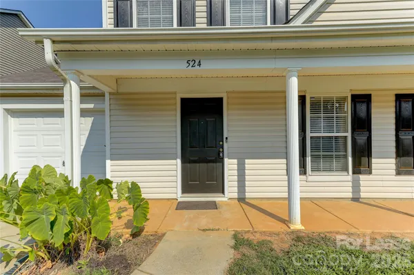 a view of a entryway door front of a house