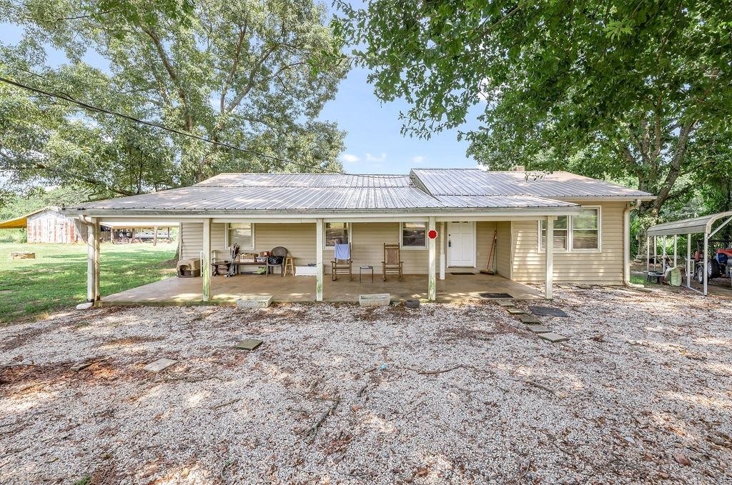 841 Racetrack Road Danielsville, GA 30633 - Photo 1 of 1 a front view of a house with a garden