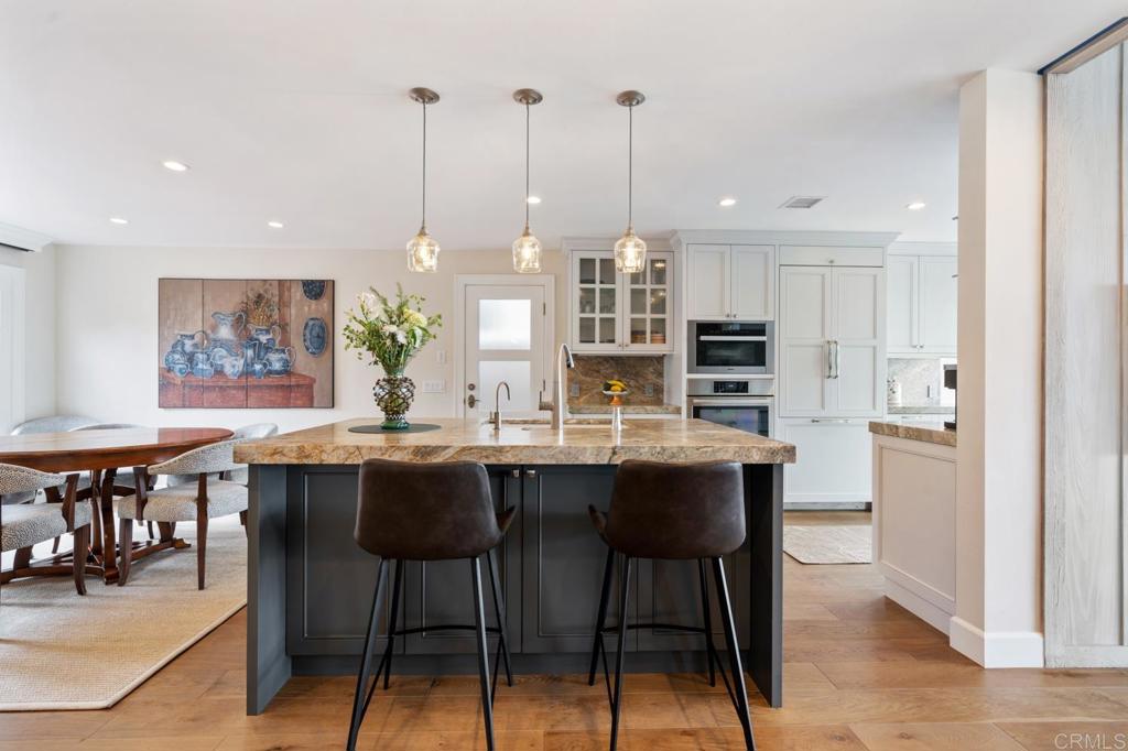 2028 Ocean Front Del Mar, CA 92014 - Photo 16 of 32 a dining table with chairs and window