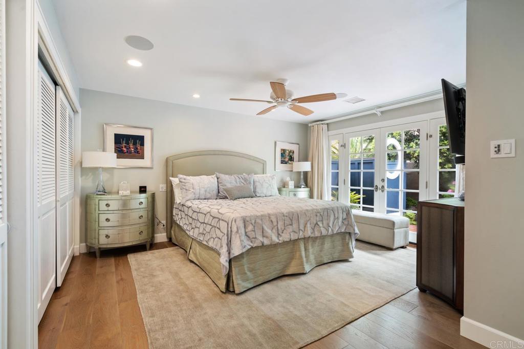 2028 Ocean Front Del Mar, CA 92014 - Photo 21 of 32 a bedroom with a bed and a large window