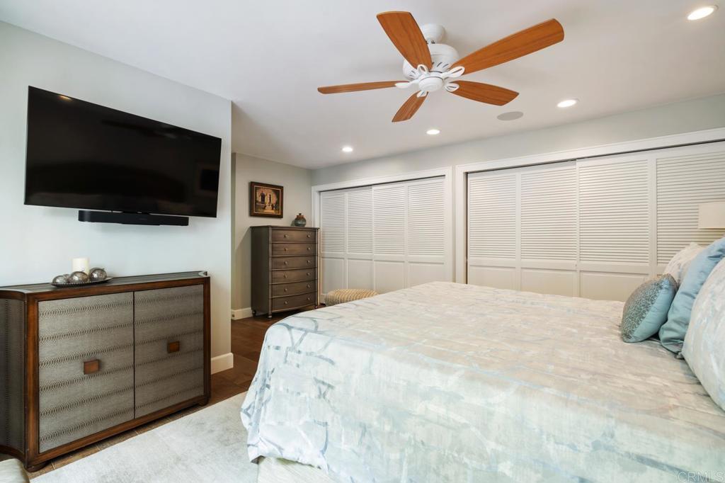 2028 Ocean Front Del Mar, CA 92014 - Photo 24 of 32 a bedroom with a bed and a flat screen tv